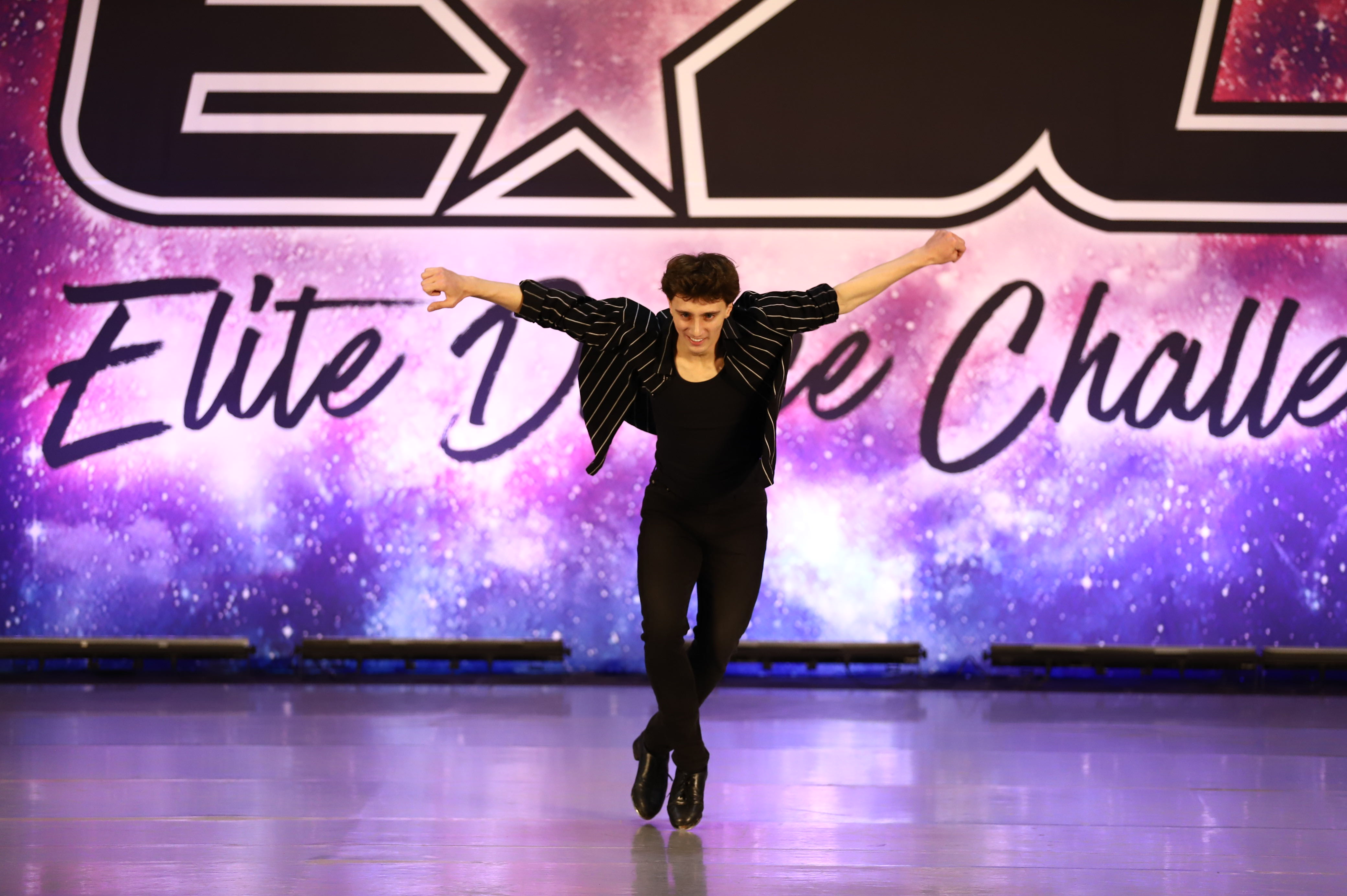 Male dancer performing solo at Elite Dance Challenge competition