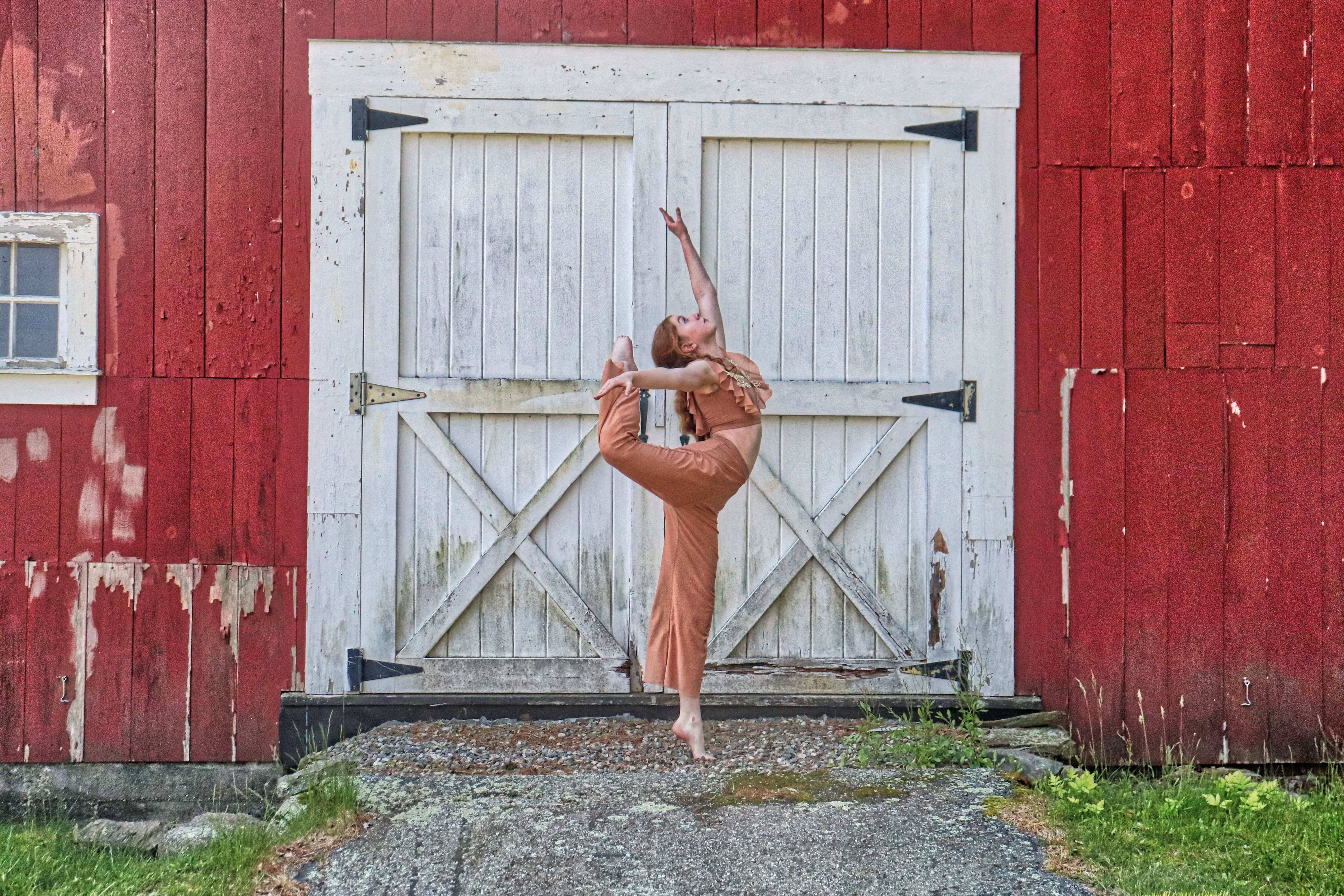 Happy young dancer with beach ball